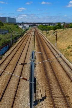 Empty railroad with posts and wires Stock Photos