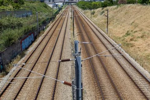 Empty railroad with posts and wires Stock Photos