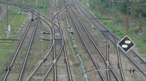 Empty railroad track with some train switches and electrical wires leading off Stock Footage