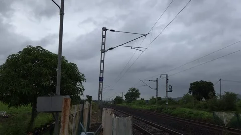 An empty railroad track transitioning from a solar lamp post Stock-Footage 342477288