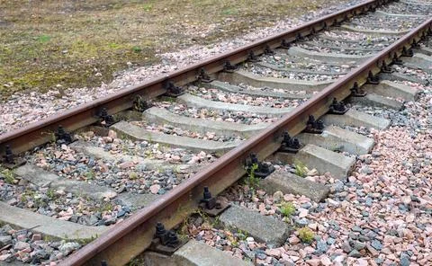 Empty railroad track under a blue sky, from left to right. Railroad lines. .. Stock Photos