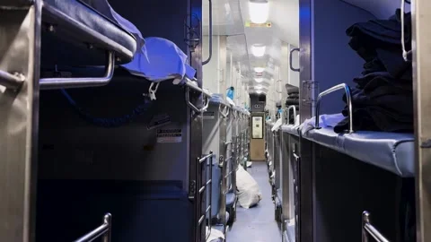 Empty railway 3ac compartment with bunk beds and blue lighting Stock Footage 333907330