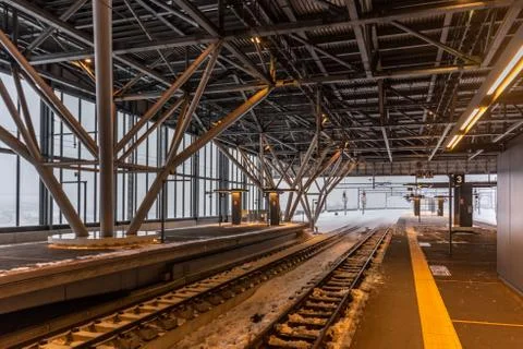 Empty railway and platform covered with white snow Stock Photos
