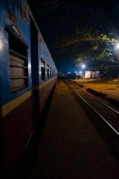 Empty railway platform at night with no people around. Stock Photos