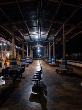 Empty railway platform at night with no people around. Stock Photos