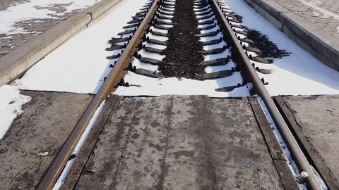 Empty railway road covered with snow and illuminated by the sun. Stock Footage 103435836