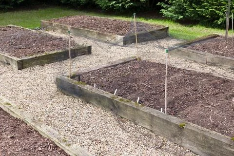 Empty raised vegetable beds in spring, UK vegetable garden Stock Photos