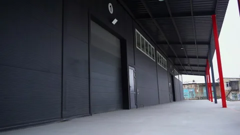 Empty ramp of large industrial complex with black facade Video stock 304394329