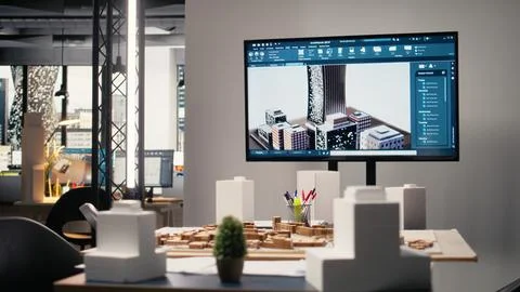 Empty real estate development office filled with blueprints and 3D models Stock Photos
