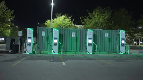 The empty recharging Electrify America stations for electro mobiles at night Stock Footage 318367497