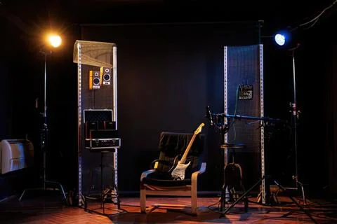 Empty recording studio with guitar and chair 库存照片