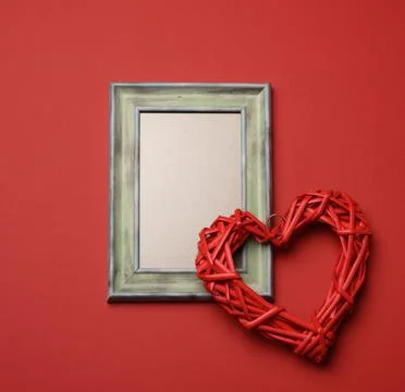 Empty rectangular blank wooden frame, red background 写真素材