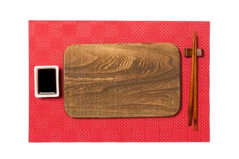 Empty rectangular brown wooden plate with chopsticks for sushi and soy sauce  Stock Photos