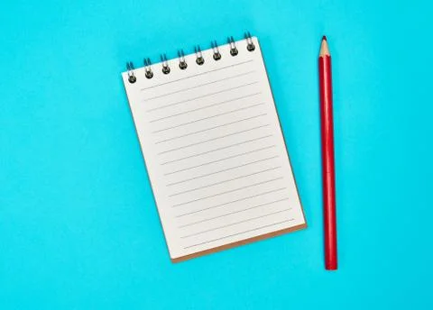 Empty rectangular notepad and wooden red pencil 写真素材