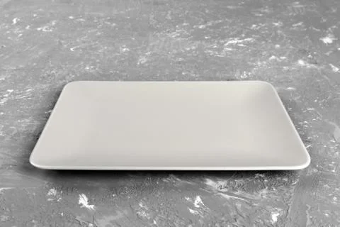 Empty rectangular Plate on gray table background Stock Photos