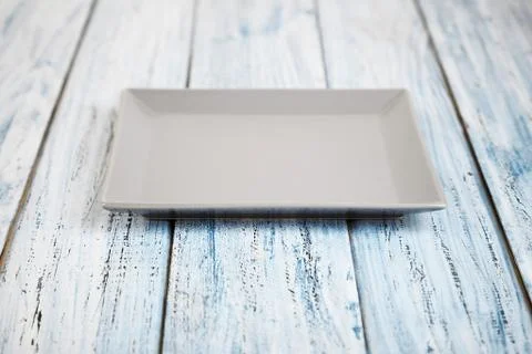 Empty rectangular Plate on wooden table background Stock Photos