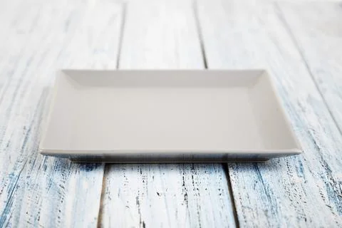 Empty rectangular Plate on wooden table background Stock Photos