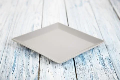 Empty rectangular Plate on wooden table background Stock Photos