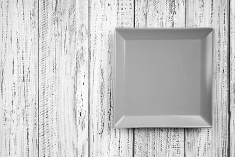 Empty rectangular Plate on wooden table background Stock Photos