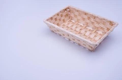 Empty rectangular wicker canister on a white background Stock Photos