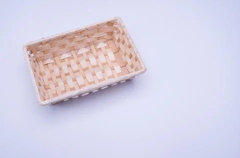 Empty rectangular wicker canister on a white background 写真素材