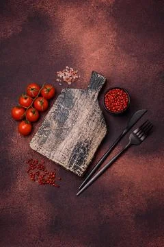 Empty rectangular wooden cutting board on textured concrete background Stock Photos