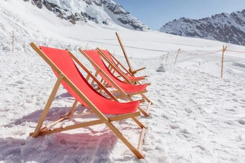 Empty red beds on the snow, relaxing concept Foto stock