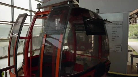 Empty red cable car at a tourist destination Stock Footage 203960220
