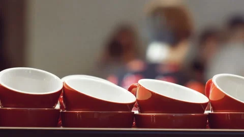 Empty red cups for espresso and for coffee and milk standing and warming up on Video stock 100402052