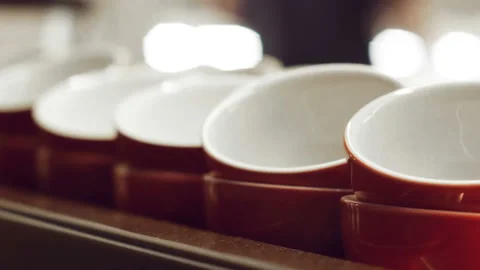 Empty red cups for espresso and for coffee and milk standing and warming up on Video stock 100402162