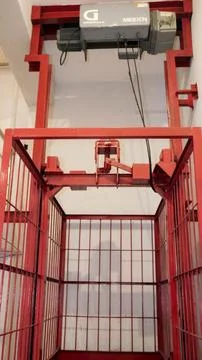 Empty red metal cage storage for fire extinguisher Stock Photos