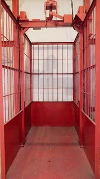 Empty red metal cage storage for fire extinguisher Stock-Fotos