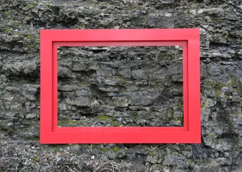 This empty red metal frame may be filled with whatever. Stock Photos