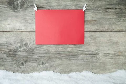 Empty red paper sheet on old wooden background Stock Photos