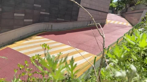 Empty Red Paved Sloped Road with Speed Humps in Residential Area Video stock 342516271
