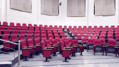 Empty Red Plastic Chairs Arranged in Rows Inside Hall 스톡 동영상 329178474