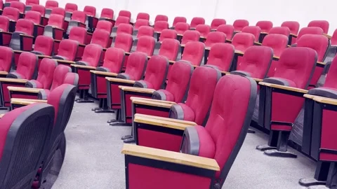 Empty Red Plastic Chairs Arranged in Rows Inside Hall Stock-Footage 329178523
