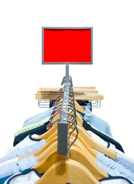 Empty red rectangular promotional display sign mockup over a clothing rack in Fotos Stock