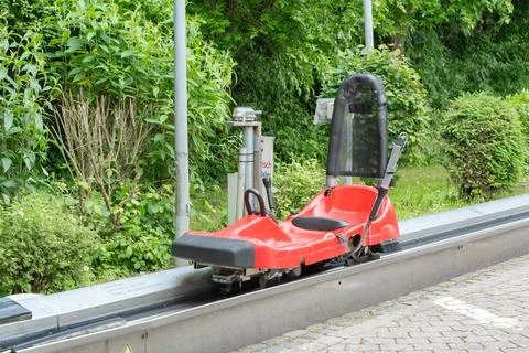 Empty Red Roller Coaster Sled at Track End Stock Photos