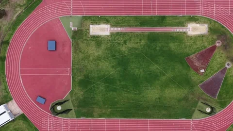 Empty red running track aerial top down view Stock Footage 337811180