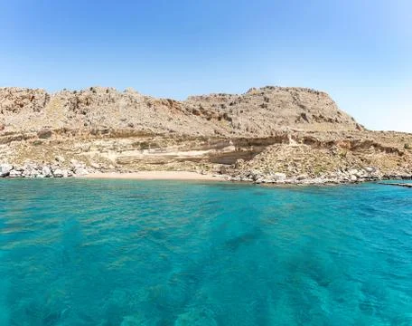 Empty Red Sand beach accessible only by boat (Rhodes, Greece) Stock Photos