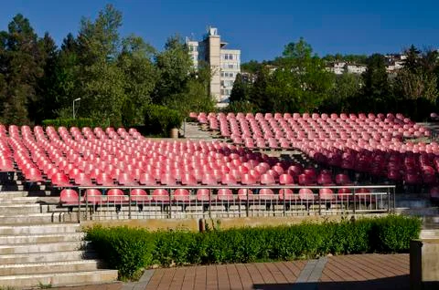 Empty red seats in an open space Stock Photos