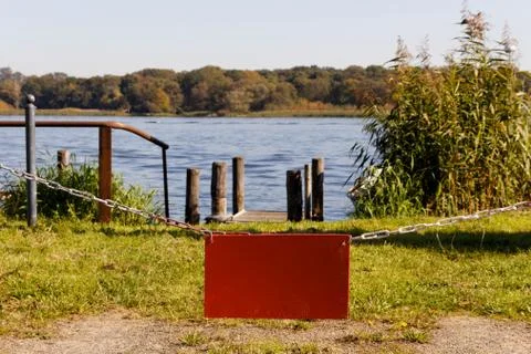 Empty Red Sign before Lake Stock Photos