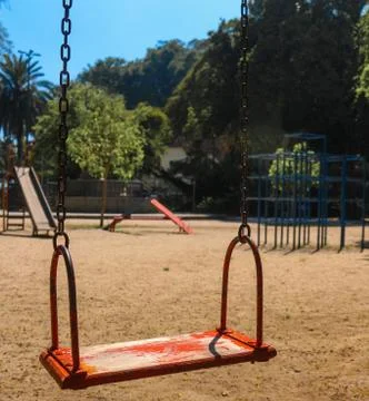 Empty red swing. Stock Photos