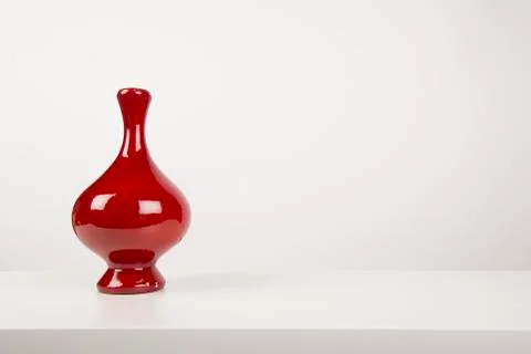 Empty red vase, in a white design interior with copy space Stock Photos