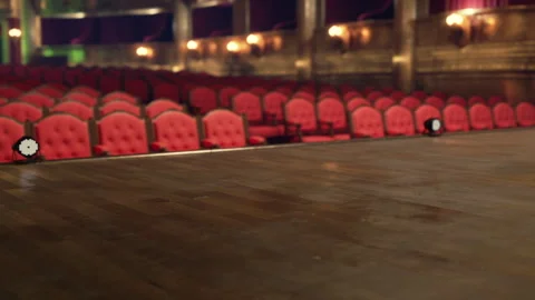 Empty red velvet seats in an old opera house before a performance begins Stock Footage 327864935