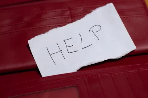 Empty red wallet with HELP text on white paper. Economic crisis due to Covid-19 Stock Photos