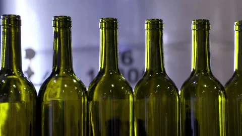 Empty red wine bottles on a coveyer belt ready for filling in South Australia Stock Footage 131307378