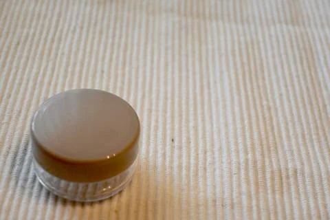 Empty Refillable Round Cosmetic Container for Travel on White Background, Copy S Stock Photos
