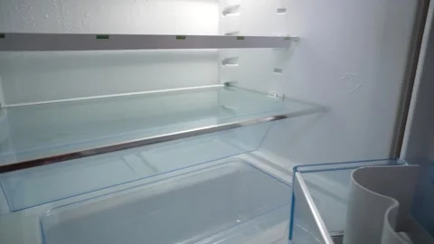 An empty refrigerator with the door open. Stock Footage 334943763